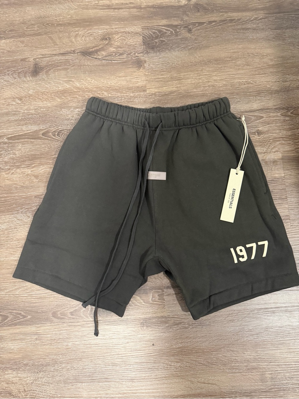 ESSENTIALS Men’s Black Athletic Shorts with 1977 Graphic